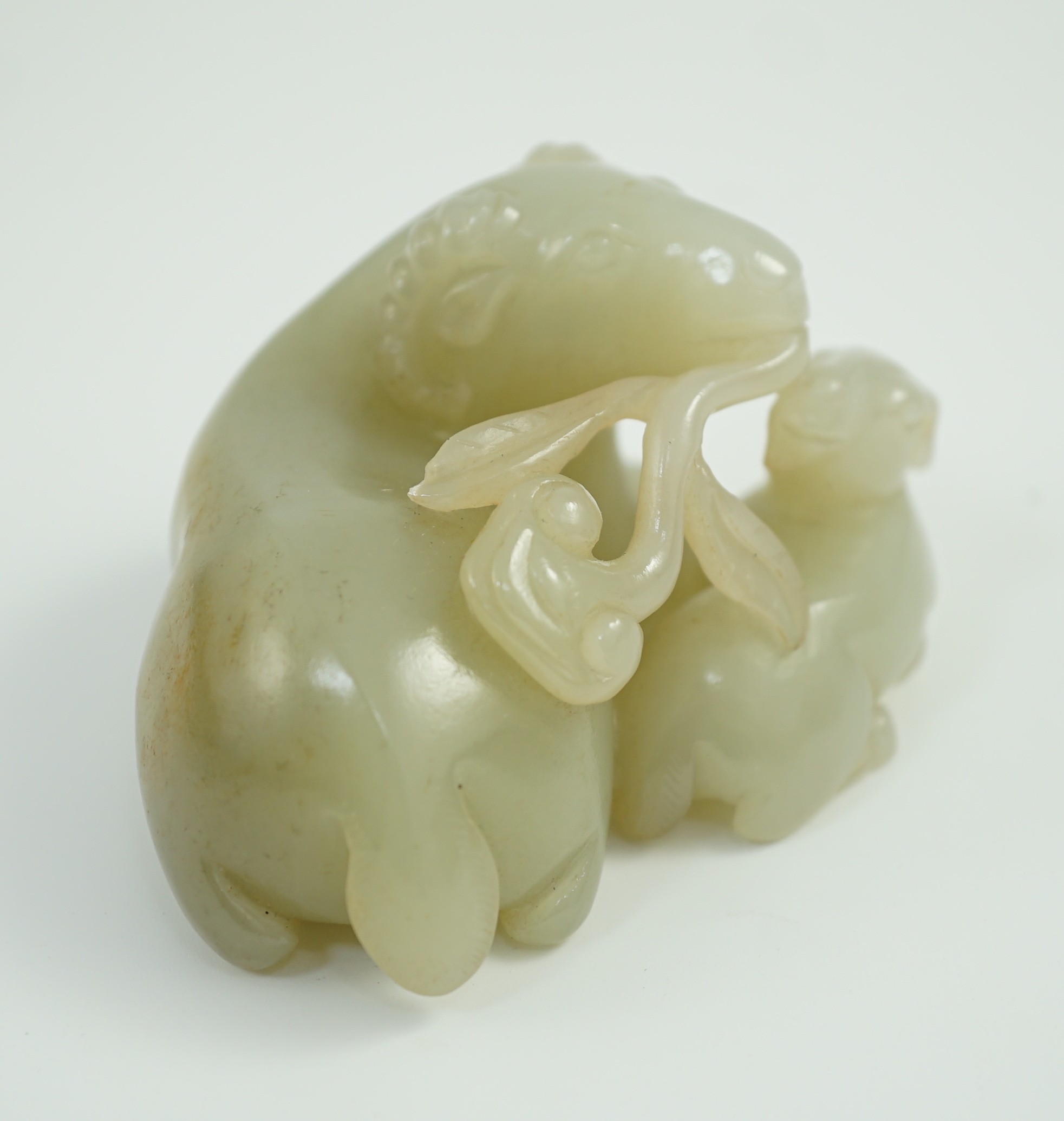 A Chinese pale celadon jade ram group, 7cm long